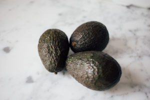 Three Avocados on Table