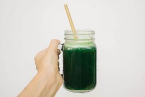 Woman Holding Mean Green Juice
