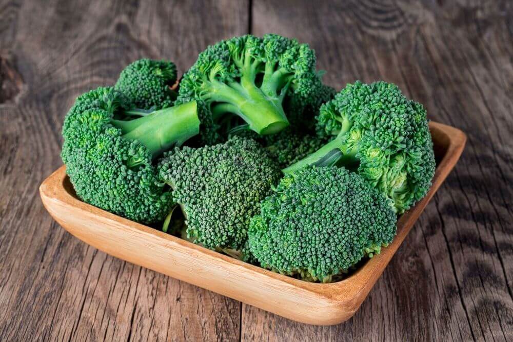 Raw Broccoli on Wooden Table